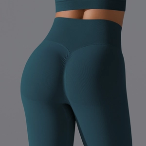 Detail of high waist seamless yoga pants with scrunch butt lifting design in navy blue
