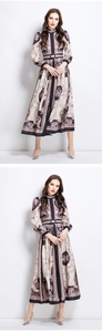 Close-up of vintage royal pattern dress featuring stand collar and button details