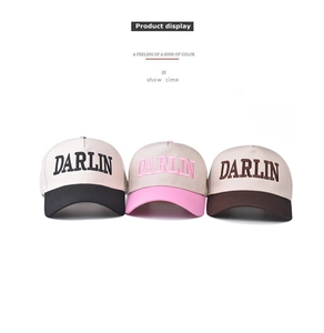 Detailed close-up of three color-block cotton baseball caps with DARLIN embroidery