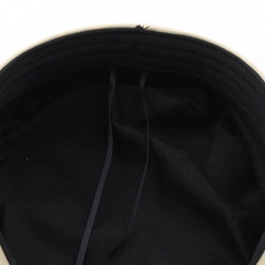 Detail of adjustable inner ribbons and sweatband inside the retro flat top sailor hat