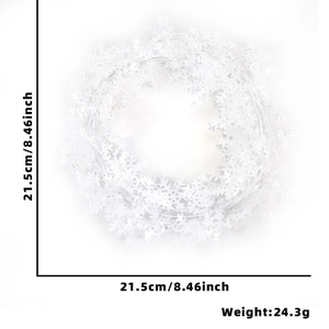 White snowflake holiday ornament measuring 21.5cm in diameter and weighing 24.3g