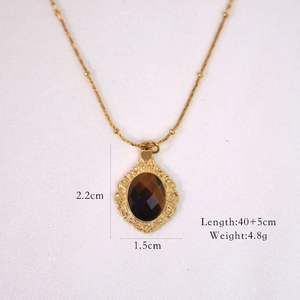 Detail view of tiger eye necklace with dimensions 2.2cm pendant and 45cm chain length