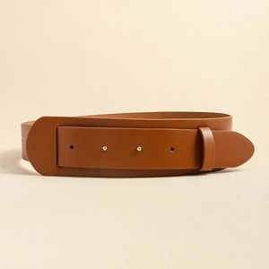 Close-up of brown leather wide belt with double eyelets and metal buckle detail