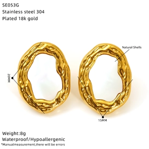 Detail of 18K gold plated oval earrings with natural shell inlay and waterproof features