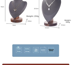 Macro view of walnut wood base and grey velvet necklace busts in two different sizes