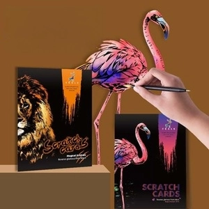 Detail of animal-themed scratch art kit featuring colorful lion and flamingo designs