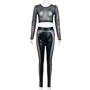 Detail of black mesh patchwork on long sleeve crop top and high waist faux leather pants