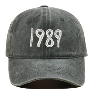 Detailed view of the 1989 embroidery on a vintage washed cotton baseball cap texture