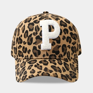 Detail of leopard print baseball cap featuring a white towel embroidered letter P patch