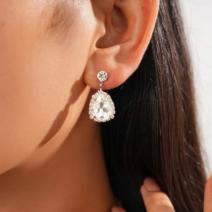 Close-up of vintage teardrop earrings featuring sparkling clear zirconia in silver finish