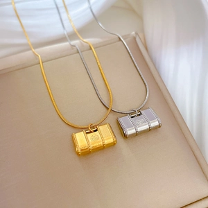 Titanium steel necklaces with gold and silver Fú bag pendants on snake bone chains