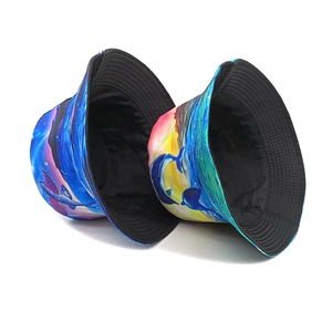 Fisherman bucket hat with vibrant dolphin and flying fish sunset print on white background