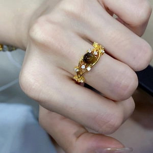 Retro gold plated ring featuring a large tiger eye stone and sparkling zircon accents