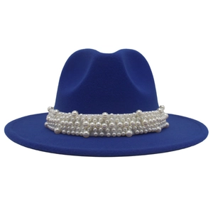 Detailed view of wide-brimmed royal blue wool felt fedora with elegant pearl beaded trim