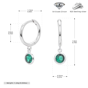Detail view of 925 sterling silver hoop earrings with emerald green zircon pendants