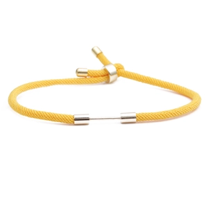 Adjustable red Milan rope bracelet with a gold metal slider bar on white background