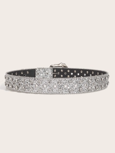 Close-up of silver rhinestone belt with double metal eyelets and glitter finish