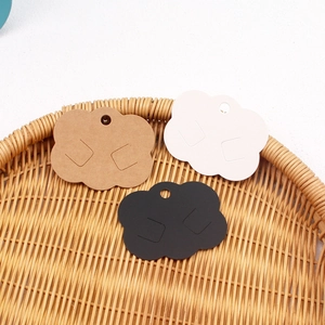 Cloud-shaped paper jewelry cards for earrings and necklaces in brown, white and black