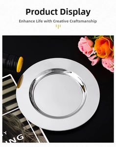 Close-up of a round stainless steel plate with a polished mirror finish for food
