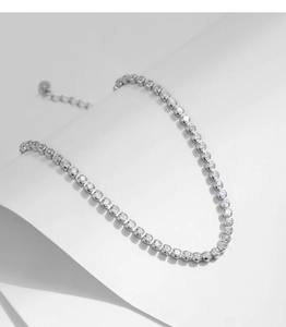 Detail of silver S925 tennis bracelet featuring classic four-prong set sparkling zircons