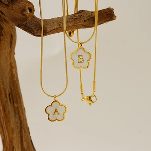 18K gold plated snake chain necklace with shell clover pendant and custom gold letters