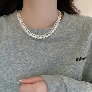 French style double-layer pearl necklace featuring layered small beads and large white pearls