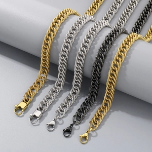 Detail of multi-color Cuban link chains in gold, silver, and black with lobster clasps