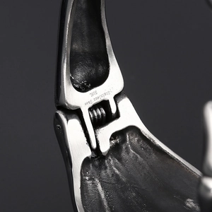 Detail of 316L stainless steel spring clasp showing high-quality metal texture and engraving