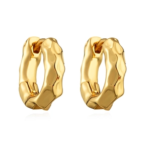 Irregular lava textured gold hoop earrings with a minimalist geometric metal design