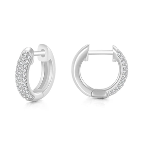 Macro shot of silver hoop earrings with pavé set cubic zirconia and polished metal finish
