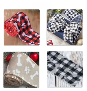 Macro detail of plaid ribbons with dog bone and paw prints for festive gift wrapping