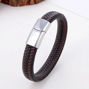 Detail view of handmade braided leather bracelet with silver magnetic metal clasp