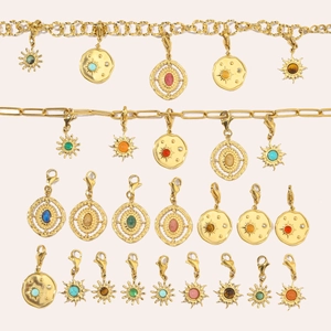 Gold stainless steel necklace set with sun pendants and natural stones in flat lay
