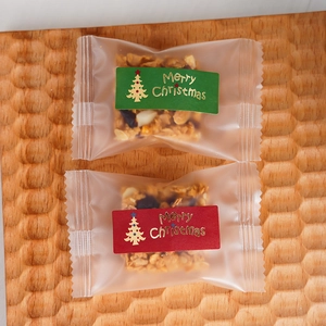 Christmas tree kraft paper stickers on frosted food bags with Merry Christmas gold stamping
