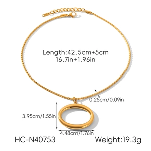 Detailed view of gold oval pendant necklace showing twist chain and size measurements