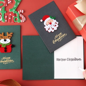 Vintage 3D felt Christmas cards with pearl paper envelopes on a festive red background