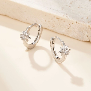 S925 sterling silver star hoop earrings featuring shimmering cubic zirconia on warm stone