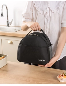 Close-up of black insulated lunch bag with side mesh pocket and Tasty Food label