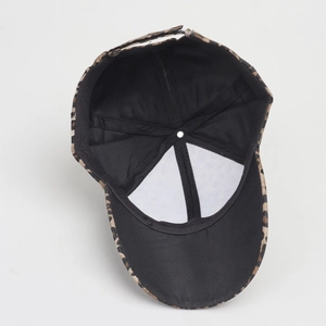 Detailed interior view of leopard print baseball cap with black lining and stitching