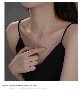 Close-up of S925 silver Y-shape tassel necklace with gold plating and delicate beads