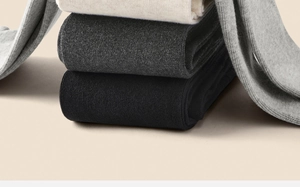 Detailed view of ribbed knit texture in grey, off-white, dark grey and black thermal leggings