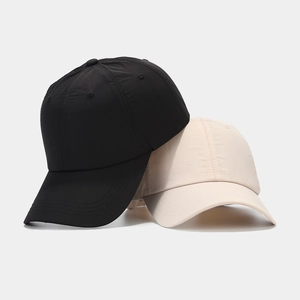 Breathable waterproof quick-dry baseball caps in black and beige with nylon texture