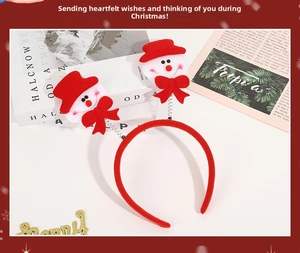 Detail of Christmas headband with spring-loaded snowmen and festive red velvet finish
