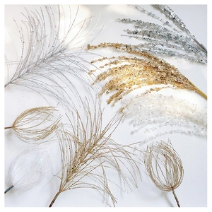 Detailed view of glittering gold and silver sequin decorative branches for Christmas bouquets