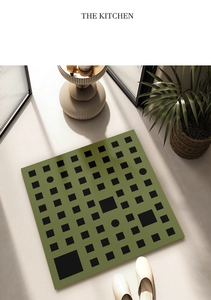 Detail view of square green diatomite bath mat with geometric pattern and anti-slip texture