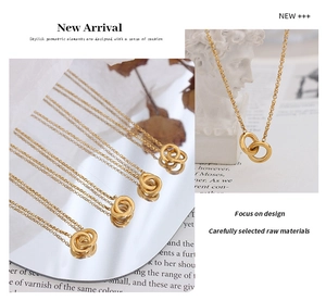 Detail of interlocking gold double ring pendant on minimalist white mannequin bust