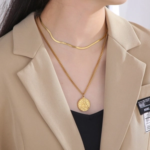 Double-layered gold titanium steel necklace with a round portrait pendant and snake chain