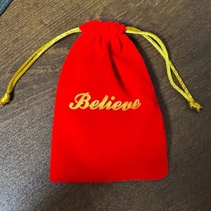 Christmas red velvet gift bag with gold Believe embroidery and metallic bells