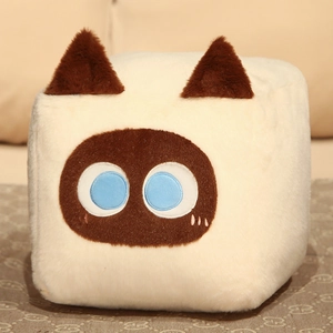 Close-up of square cat plush pillow featuring soft cream fabric and blue round eyes