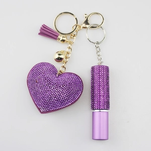 Purple crystal heart keychain with matching tassel and refillable perfume bottle charm